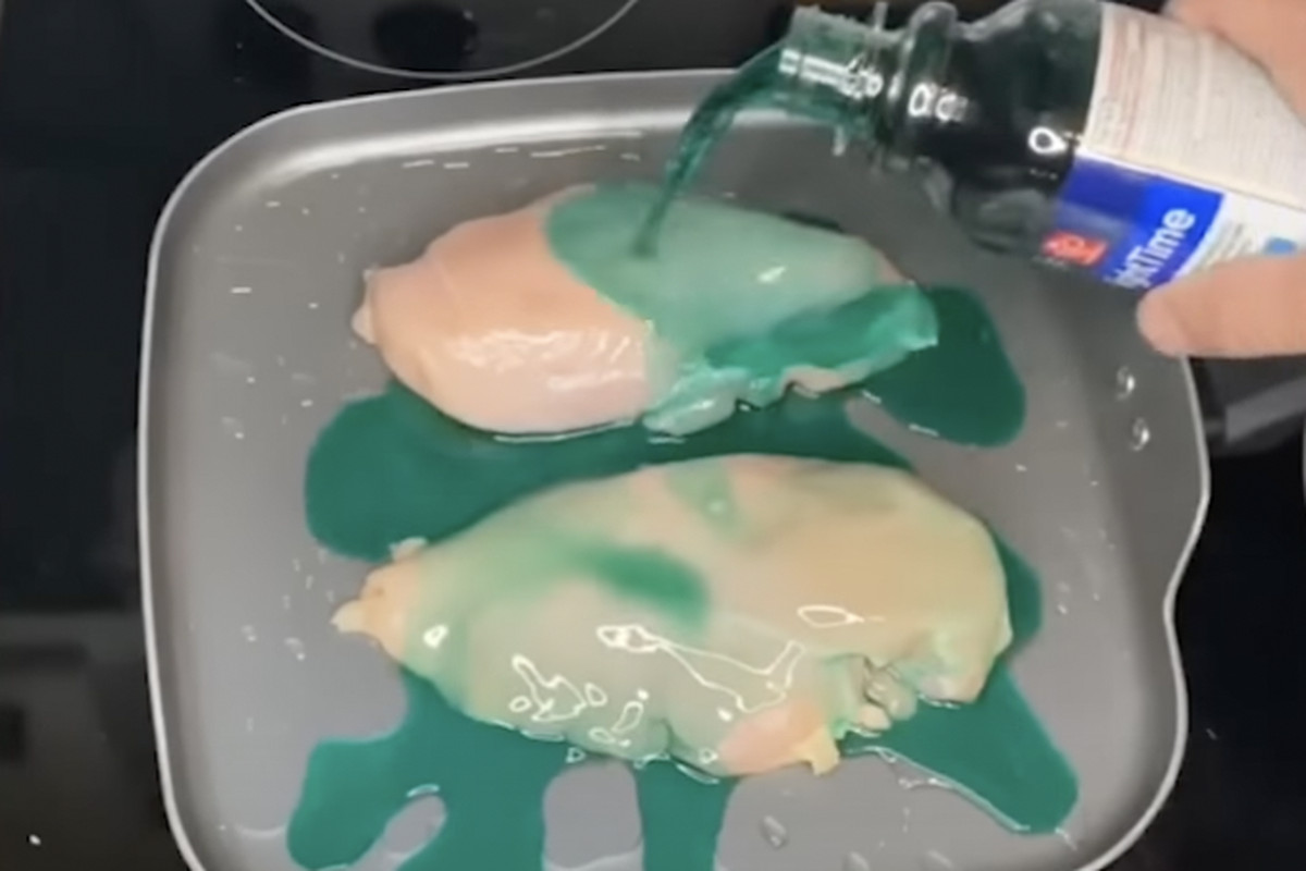 Chicken on frying pan with NyQuil poured over it